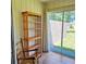 Sunroom showcasing a wooden bookshelf and sliding glass doors to the backyard at 240 Windmeadows St # 240, Altamonte Springs, FL 32701