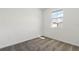 Cozy bedroom with plush carpet and natural light from the window at 2413 Brook Marsh Loop, Kissimmee, FL 34747