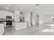 Open concept kitchen with stainless steel appliances, granite countertops and an island that overlooks the living area at 2413 Brook Marsh Loop, Kissimmee, FL 34747