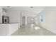 Bright living room with neutral tile flooring and plenty of natural light at 2413 Brook Marsh Loop, Kissimmee, FL 34747