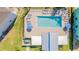 Aerial view of a pool surrounded by lounge chairs and green space at 2413 Brook Marsh Loop, Kissimmee, FL 34747