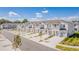 View of new townhomes featuring two-story units with individual garages and landscaped front yards at 2413 Brook Marsh Loop, Kissimmee, FL 34747