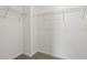 A well-organized walk-in closet featuring carpet flooring and wire shelving at 2413 Brook Marsh Loop, Kissimmee, FL 34747