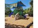Colorful community playground with slides, climbing structure and protective mulch ground cover at 2445 Cypress Trace Cir, Orlando, FL 32825