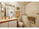 Bathroom featuring a safety tub, vanity with a sink, and neutral decor at 252 Elgin Blvd, Davenport, FL 33897