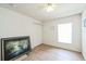 Bedroom with light wood-look floors, a ceiling fan, and a closet with sliding doors at 252 Elgin Blvd, Davenport, FL 33897