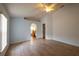 Large bedroom featuring wood-look tile flooring, natural light, and ceiling fan at 252 Elgin Blvd, Davenport, FL 33897
