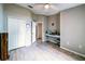 Bedroom featuring light wood-look floors, a built-in desk, and a closet with sliding doors at 252 Elgin Blvd, Davenport, FL 33897