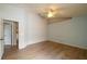 Large bedroom featuring wood-look tile flooring, ceiling fan, and a access to walk-in closet at 252 Elgin Blvd, Davenport, FL 33897