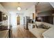 Bright kitchen features wood-look tile flooring, stainless steel appliances, and lots of natural light at 252 Elgin Blvd, Davenport, FL 33897