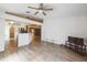 Large living room with tile floors, open to the kitchen, offering a versatile space for living and dining at 252 Elgin Blvd, Davenport, FL 33897