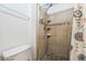 Shower with tile surround and mosaic floor at 252 Elgin Blvd, Davenport, FL 33897