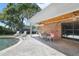 Enjoy the shade on the home's patio complete with a table, chairs and ceiling fan by the pool at 2532 Waterview Pl, Windermere, FL 34786