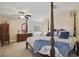 Bedroom featuring a four-poster bed, ceiling fan, and soft natural light at 2532 Waterview Pl, Windermere, FL 34786