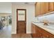 Kitchen butler's pantry door and marble countertops at 2532 Waterview Pl, Windermere, FL 34786