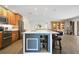 Spacious kitchen with island seating, built-in wine rack and stainless steel appliances at 2532 Waterview Pl, Windermere, FL 34786