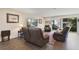 Comfortable living room featuring plush seating, a patterned rug, and natural light at 2532 Waterview Pl, Windermere, FL 34786