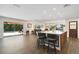 Open-concept living room with kitchen island, and sliding glass doors at 2532 Waterview Pl, Windermere, FL 34786