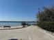 Picturesque waterfront access with a charming pier and a serene sandy beach, ideal for relaxation and enjoying water activities at 2532 Waterview Pl, Windermere, FL 34786
