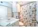Full bathroom featuring a white vanity, toilet, and a shower with leaf pattern curtain at 2609 Chinook Trl, Maitland, FL 32751