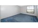Neutral bedroom features a window for natural light and neutral paint and carpet at 2609 Chinook Trl, Maitland, FL 32751
