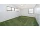Bedroom featuring green carpet, and two windows with natural light at 2609 Chinook Trl, Maitland, FL 32751
