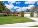 Well-maintained brick home with a two-car garage and a verdant front lawn at 2609 Chinook Trl, Maitland, FL 32751