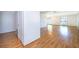 Spacious living room featuring pristine wood floors and large windows for ample natural light at 2609 Chinook Trl, Maitland, FL 32751