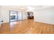 Bright living room featuring wood flooring and an open concept kitchen with recessed lighting at 2609 Chinook Trl, Maitland, FL 32751