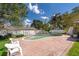 Private backyard pool is surrounded by a brick patio and lush landscaping at 2609 Chinook Trl, Maitland, FL 32751