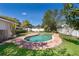 Backyard features a refreshing pool, surrounded by a red brick patio, for ultimate relaxation and enjoyment at 2609 Chinook Trl, Maitland, FL 32751