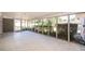 Bright sunroom with tiled floor and screened windows overlooking lush landscaping and outdoor space at 2609 Chinook Trl, Maitland, FL 32751