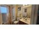 Neat bathroom with vanity, toilet, bath tub, and decorative shower curtain at 2618 Lodi Cir # 102, Kissimmee, FL 34746