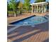 Outdoor hot tub with brick pavers, gazebo, and lounge chairs at 2618 Lodi Cir # 102, Kissimmee, FL 34746