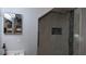 Contemporary shower with marble-look tile, glass door, and built-in niche for storage at 2618 Lodi Cir # 102, Kissimmee, FL 34746