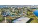 Community aerial showing a waterpark, sand volleyball court, and well-maintained landscaping at 2771 Oxymoron Way, Kissimmee, FL 34746