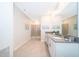 Modern bathroom features double vanity, sleek countertops, and a glass-enclosed shower at 2771 Oxymoron Way, Kissimmee, FL 34746
