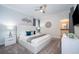 Serene bedroom with plush carpet, contemporary furnishings, and ensuite bathroom access at 2771 Oxymoron Way, Kissimmee, FL 34746