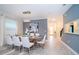 Elegant dining room with modern chandelier, stylish decor, and ample seating at 2771 Oxymoron Way, Kissimmee, FL 34746