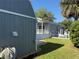 Shed with a well-maintained lawn, creating a blend of outdoor storage and a landscaped yard at 3067 Ne 102Nd Avenue Rd, Silver Springs, FL 34488