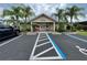 Community clubhouse featuring well-manicured landscaping, adding charm to neighborhood amenities at 3067 Ne 102Nd Avenue Rd, Silver Springs, FL 34488