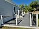 Spacious, well-maintained deck with modern railings and stairs for outdoor enjoyment and relaxation at 3067 Ne 102Nd Avenue Rd, Silver Springs, FL 34488