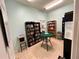 Community library with bookshelves and reading area creates a quiet space to enjoy books and movies at 3067 Ne 102Nd Avenue Rd, Silver Springs, FL 34488