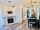 Inviting living space featuring modern fireplace, and an eat-in kitchen with stainless steel appliances at 3067 Ne 102Nd Avenue Rd, Silver Springs, FL 34488