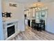 Bright and airy living space with a modern fireplace that opens to a kitchen and dining area at 3067 Ne 102Nd Avenue Rd, Silver Springs, FL 34488