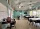 Large meeting room with tables and chairs is ready for you to host your next social gathering at 3067 Ne 102Nd Avenue Rd, Silver Springs, FL 34488