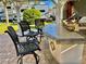 Outdoor kitchen with a bar, grill, and overhead pergola, creating the perfect space for outdoor entertaining at 3067 Ne 102Nd Avenue Rd, Silver Springs, FL 34488