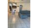 Open living area with sliding doors to the outside, modern furniture, and tile flooring at 3111 Wentworth Ln, Kissimmee, FL 34741