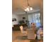 Open living area with sliding doors to the outside, modern furniture, and tile flooring at 3111 Wentworth Ln, Kissimmee, FL 34741