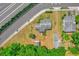 This aerial view showcases the home's proximity to lush greenery, road access, and other residences at 320 Granada Dr, Winter Park, FL 32789